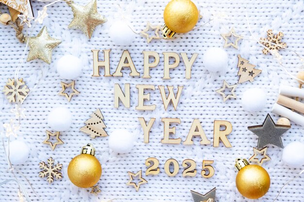 Photo happy new year wooden numbers 2025 on cozy festive white knitted background