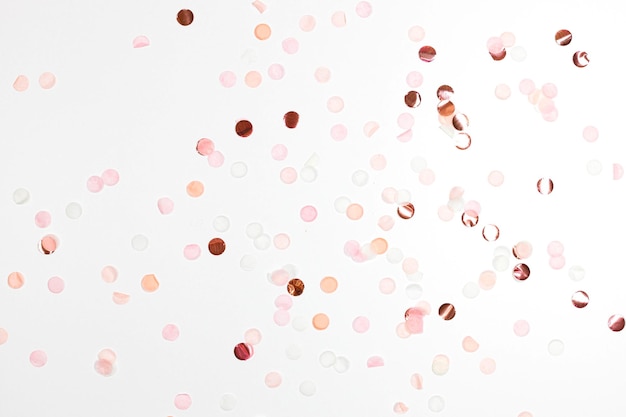 Happy New Year and Xmas or birthday festive composition Golden pink confetti on background