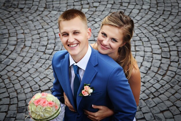 Happy newly married couple smiling Portrait close-up view from above.