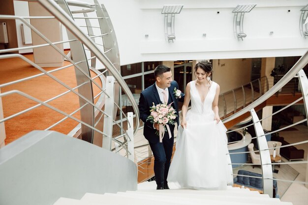 Happy Newlyweds Climb the Stairs