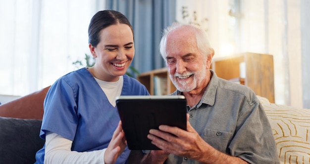happy nurse and elderly man with tablet on sofa for results and health or home consultation smile caregiver and technology in living room for retirement internet or online app for medical support