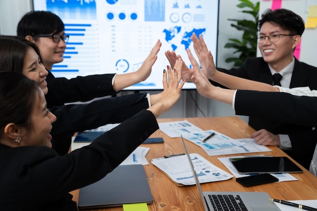 Happy office worker making high five with each other in harmony workplace