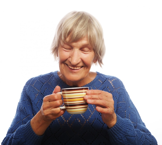 Happy old lady with coffee