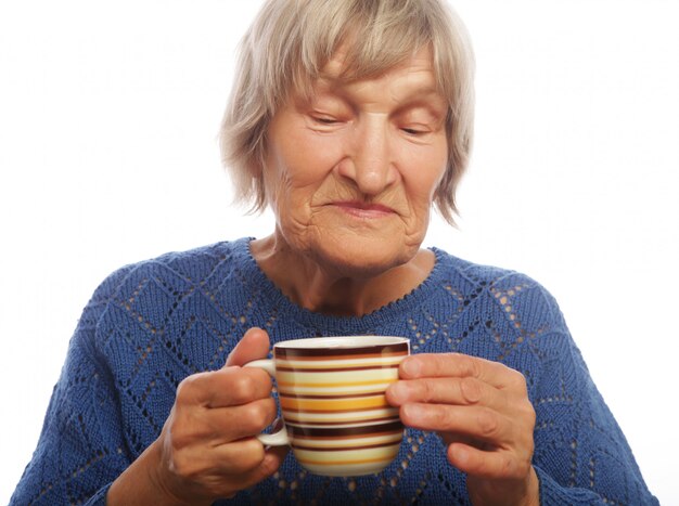 Happy old lady with coffee