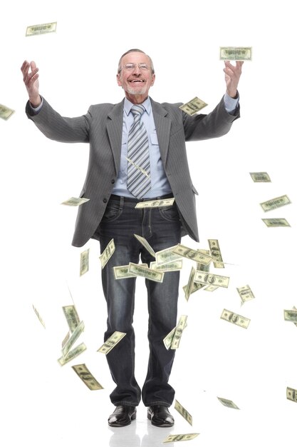 Happy old man in suit and falling dollar banknotes