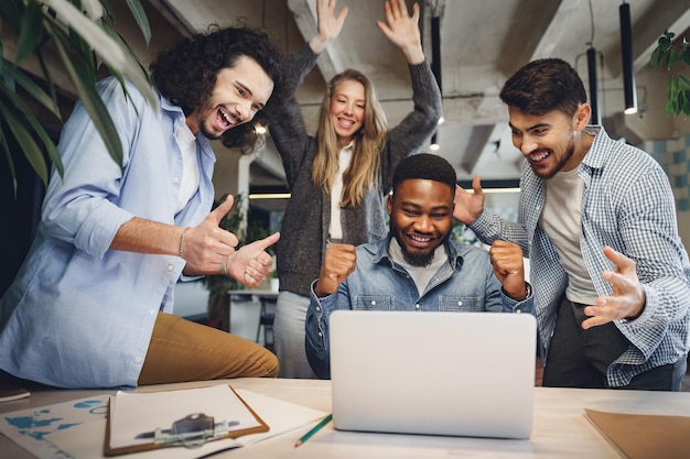 Happy overjoyed business team celebrate corporate victory