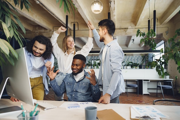 Photo happy overjoyed business team celebrate corporate victory