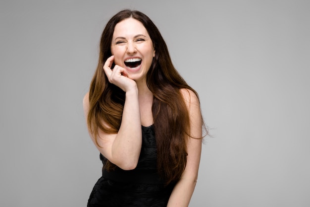 Happy overweight woman in fashionable clothes