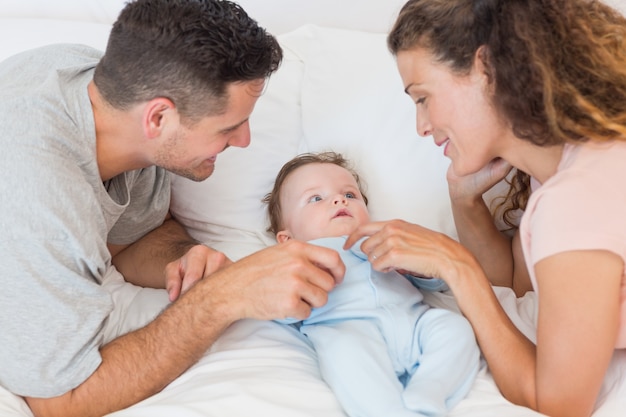 Happy parents playing with baby boy