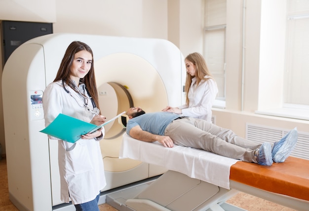 Happy patient undergoing mri scan at hospital.