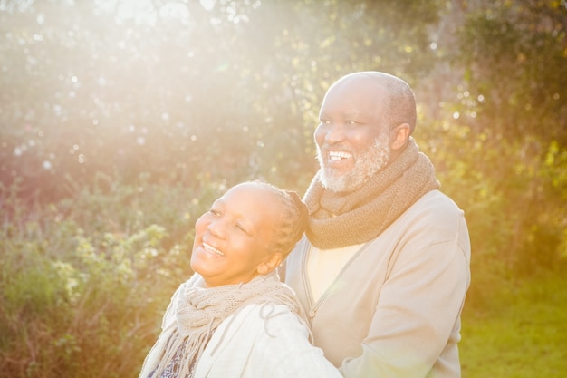 Happy peaceful senior couple embracing