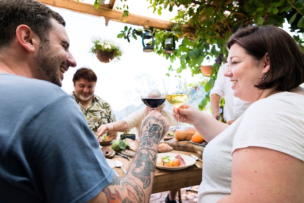 Happy people cheering with wine