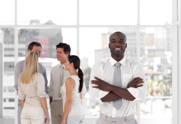 Happy people talking together at work