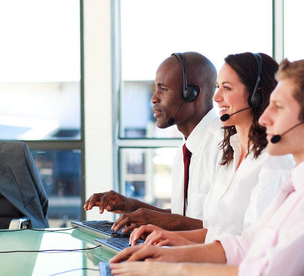 Happy people with a headset on working