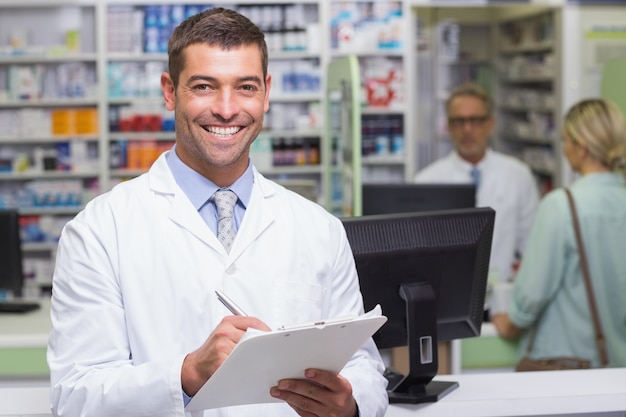 Happy pharmacist looking at camera 