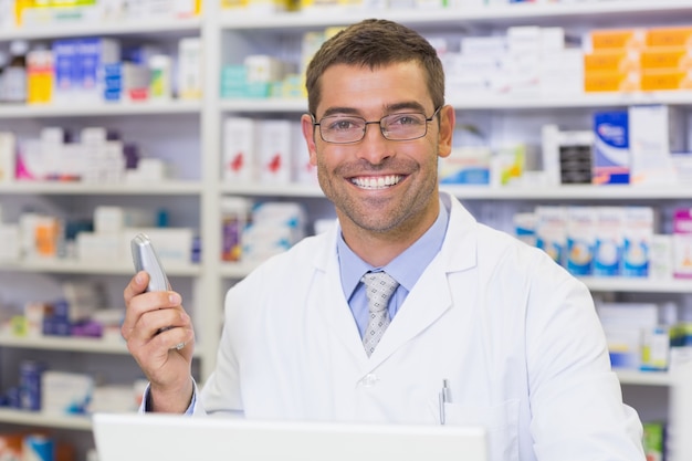 Happy pharmacist on the phone 