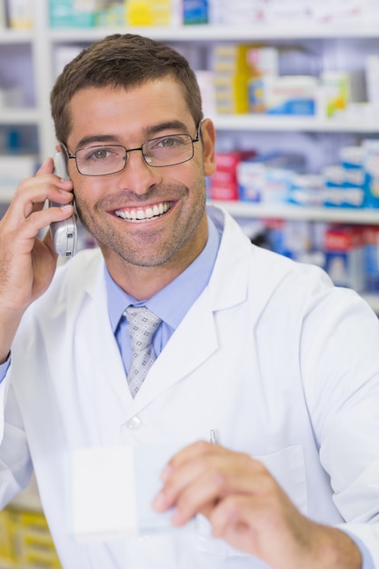 Happy pharmacist on the phone 