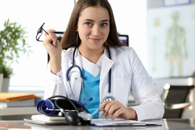 Happy physician working at clinic office