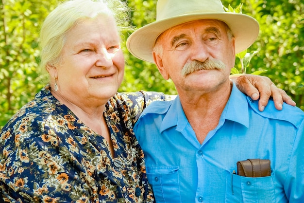 Happy portrait of an elderly couple on the nature