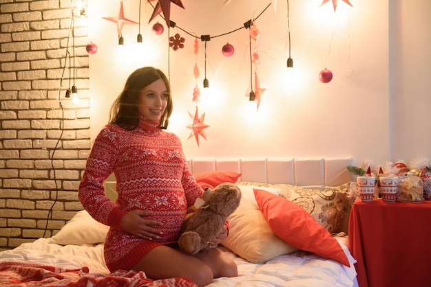 happy pregnant on bed