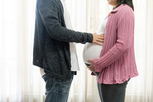 Happy pregnant couple of husband and wife.