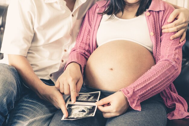 Happy pregnant couple of husband and wife.