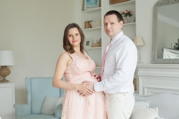 Happy pregnant couple Pregnancy maternity preparation and expectation concept