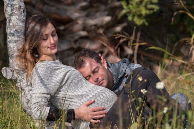 happy pregnant girl and husband