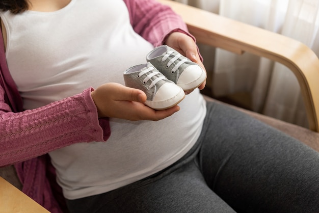 Happy pregnant woman and expecting baby.