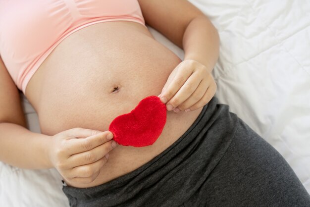 Happy pregnant woman and expecting baby.