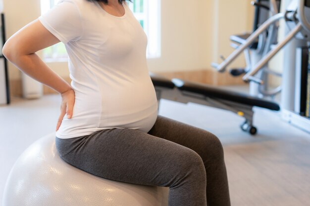 Happy pregnant woman and expecting baby.