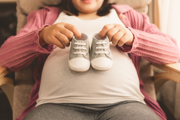 Happy pregnant woman and expecting baby.