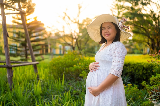 Happy pregnant woman and expecting baby.