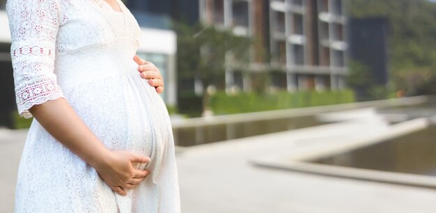 Happy pregnant woman and expecting baby.