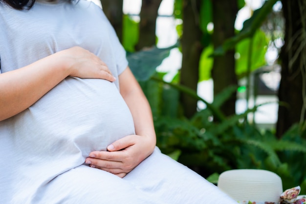 Happy pregnant woman and expecting baby.