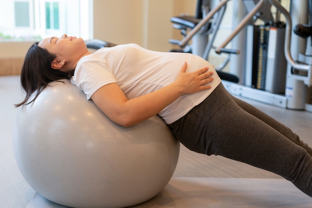 Happy pregnant woman and expecting baby.