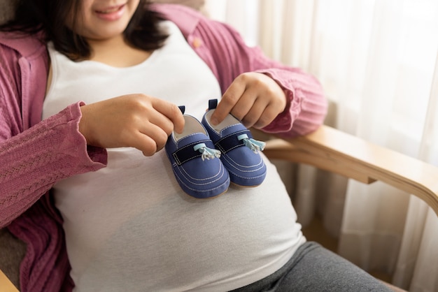 Happy pregnant woman and expecting baby.