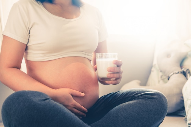 Happy pregnant woman and expecting baby.