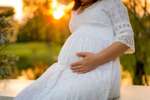 Happy pregnant woman and expecting baby.