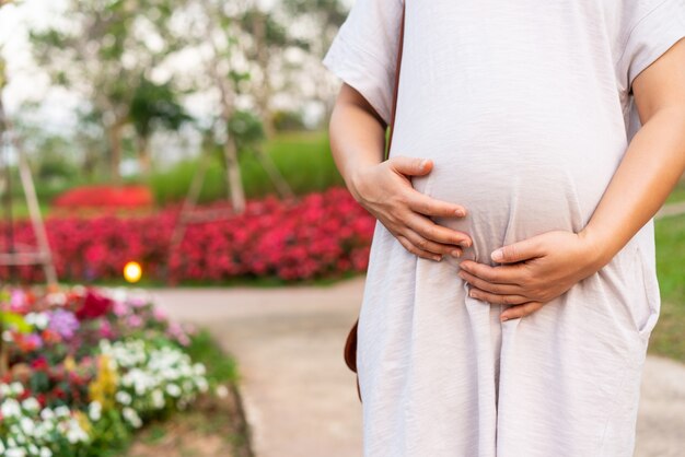 Happy pregnant woman with baby in pregnant belly. Maternity prenatal care and woman pregnancy.