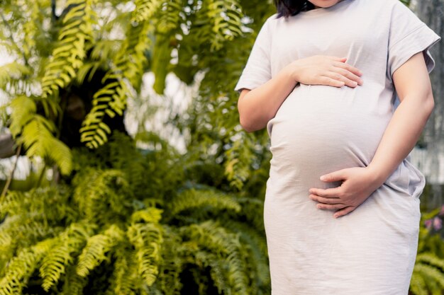 Happy pregnant woman with dress