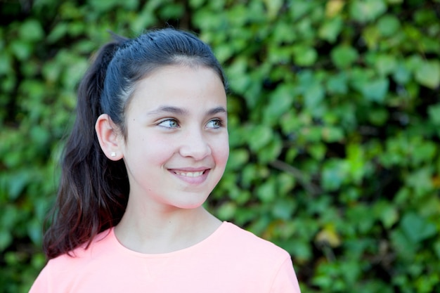 Happy preteen girl with blue eyes smiling