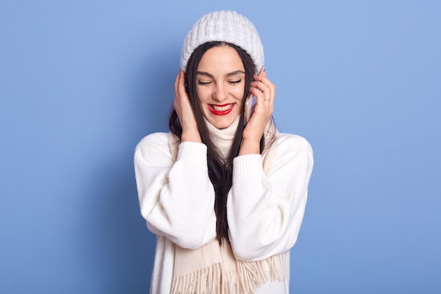 Happy pretty brunette girl talking on phone and laughing