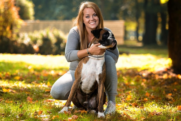 Happy Pretty Woman With German Boxer