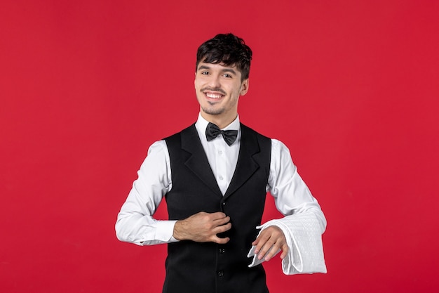 happy proud man waiter in a uniform