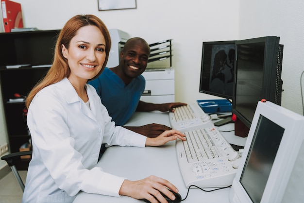 Happy Radiology Professionals Analyzing Scans