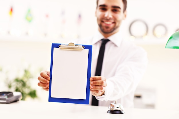 happy receptionist working in hotel