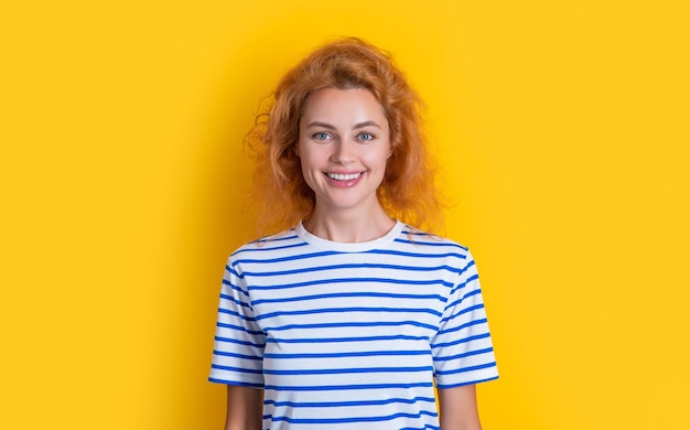 Happy redhead woman face isolated on yellow background face of young redhead woman