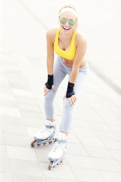 happy roller blader having fun in the city