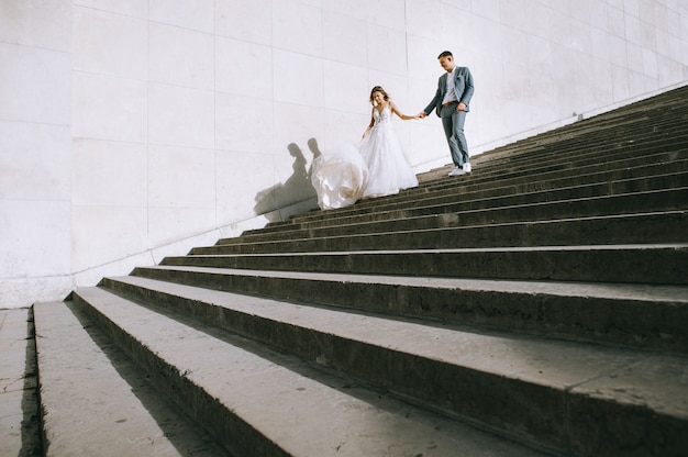 Happy romantic married couple on the stairs